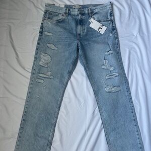 Distressed slim fit jeans